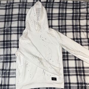 Ambercrombie & Fitch. Men’s small. Like new. White with paint splatters.